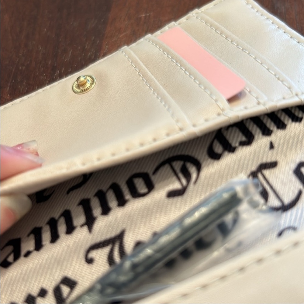 Juicy Couture Flawless Slim Elongated
Licorice Bifold - Picture 6 of 10